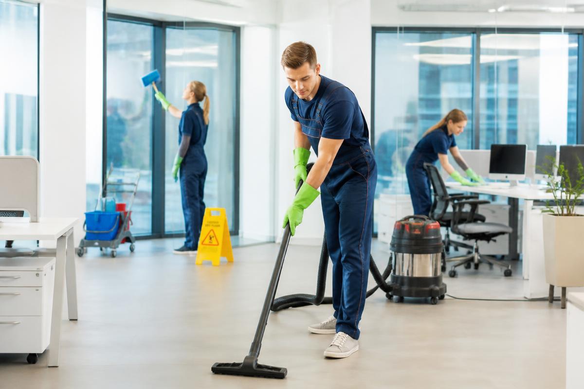 Commercial cleaning team working in a bright modern office